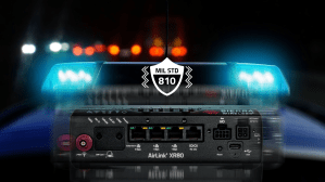 Sierra Wireless AirLink XR80 MIL-STD-810 certified rugged router for first responder and public safety vehicle connectivity with police emergency lights in background